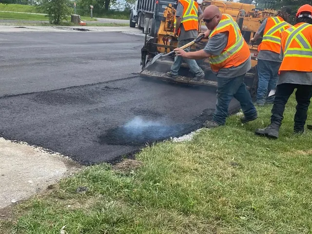 Harwick Paving crew laying fresh asphalt