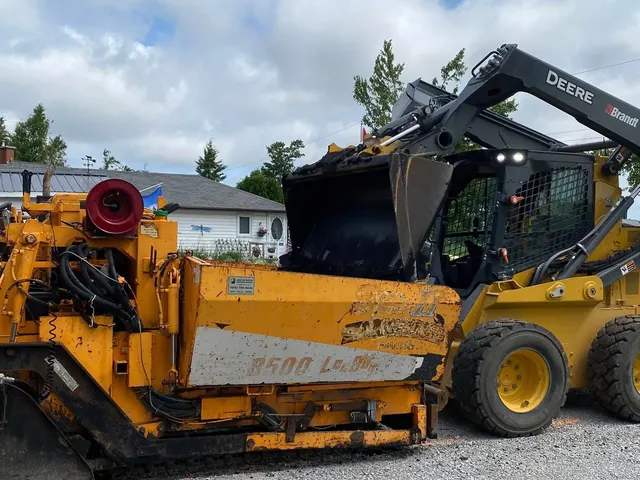 Asphalt paving machine at a Kawartha Lakes job site