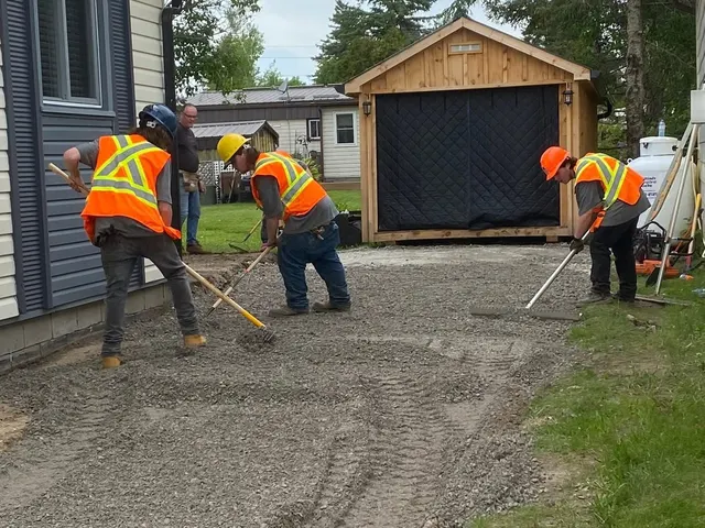 Crew paving a residential driveway